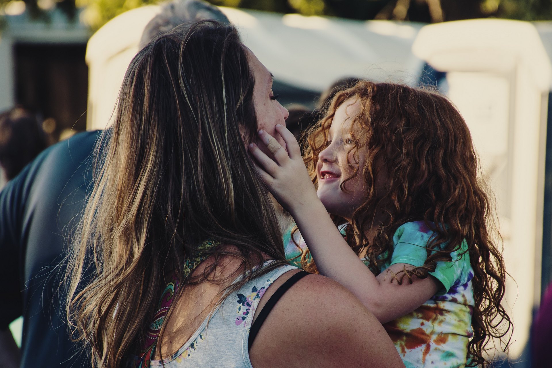 woman-carrying-girl