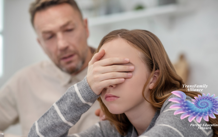 Disgruntled teen in foreground covering eyes to avoid eye contact with defensive parent in background who is stumbling through a discussion regarding using proper gender pronouns or using the right terminology with your trans child
