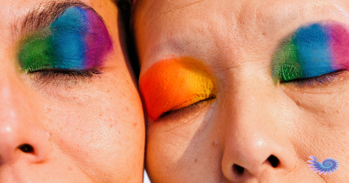 Close up of two older people with Pride makeup celebrating their intimacy and community during Pride Month